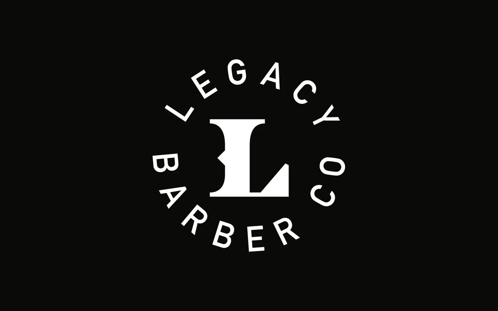 Legacy Barber Co. circle L lockup in white on black