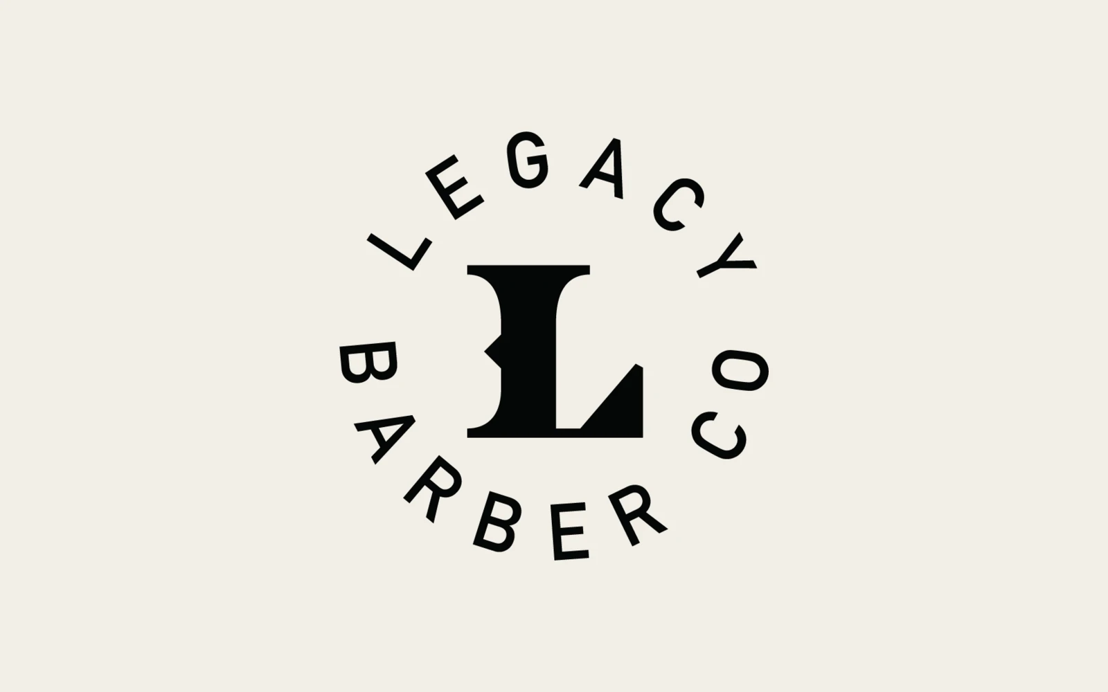 Legacy Barber Co. circle L lockup in black on cream