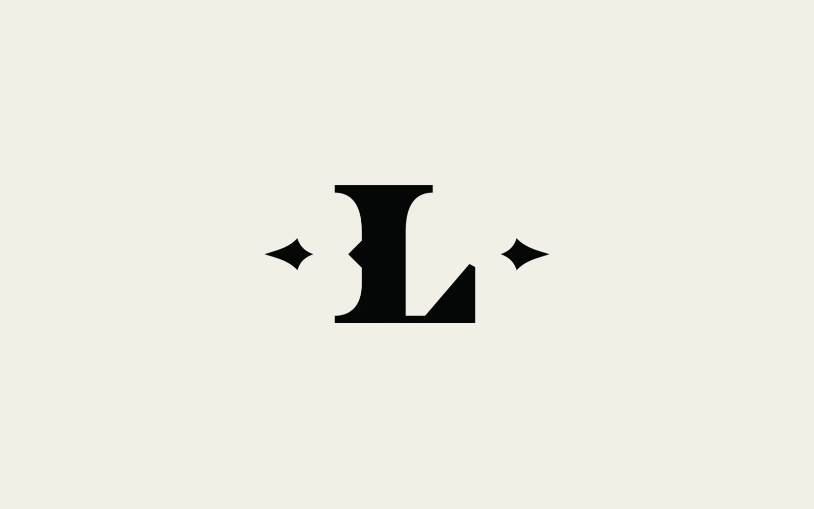 The Legacy Barber Co. L mark in black on cream